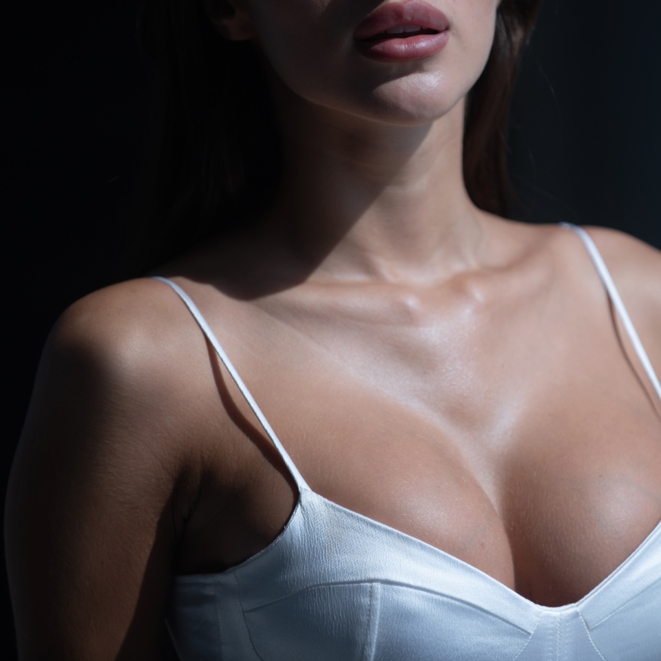 Close up beautiful body of woman big boobs. Sexy breast. Woman with natural boobs.